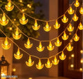 Crystal diya LED string lights glowing warm white