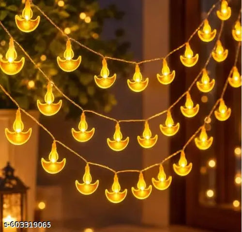Crystal diya LED string lights glowing warm white